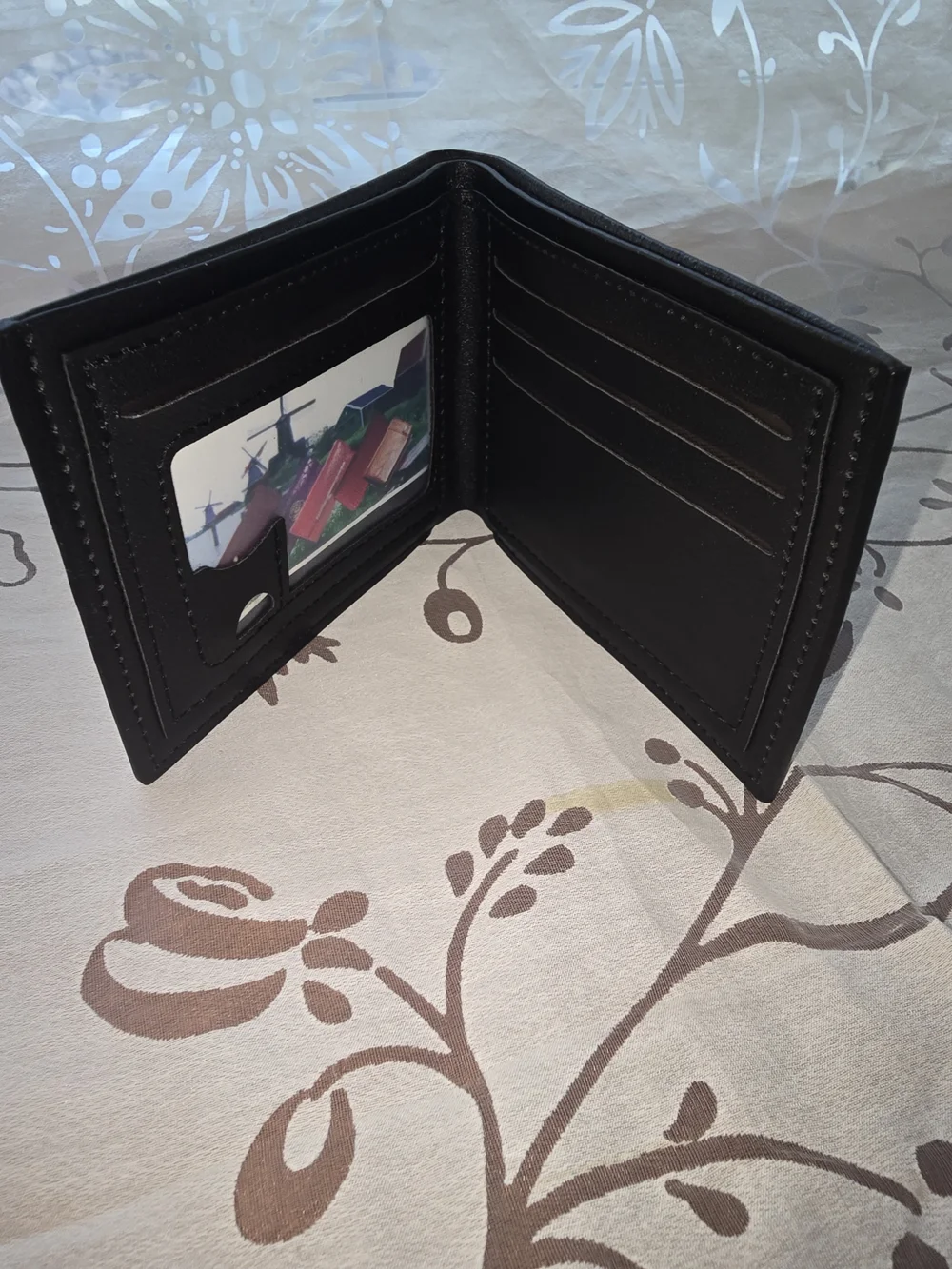 Men's Black Leather Bi-Fold Wallet with Metal Accent